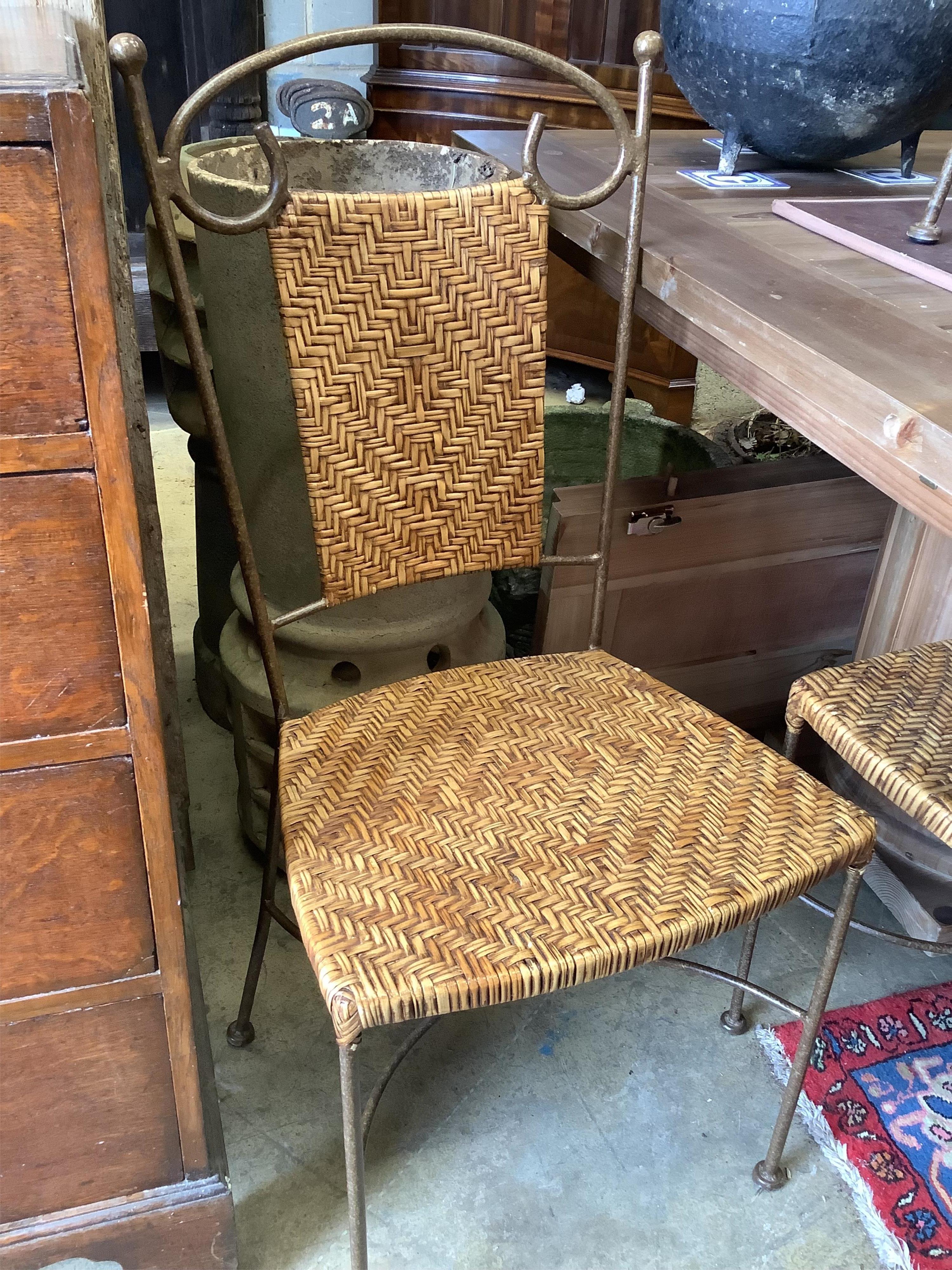 A set of contemporary wrought iron and rattan dining chairs